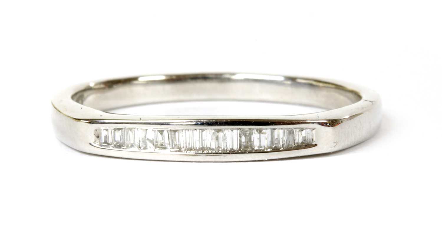 Lot 89 - A white gold diamond half eternity ring
