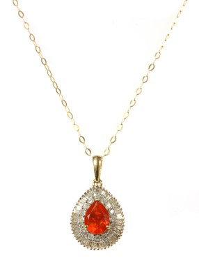 Lot 172 - A gold fire opal and diamond cluster pendant