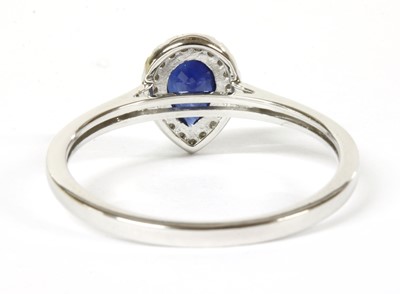 Lot 111 - A white gold sapphire and diamond cluster ring