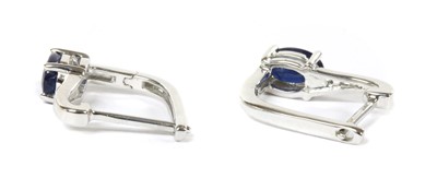 Lot 143 - A pair of white gold sapphire and diamond earrings