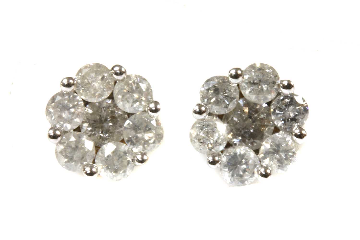 Lot 167 - A pair of gold diamond cluster earrings