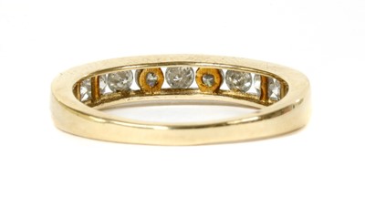Lot 128 - A gold diamond half eternity ring