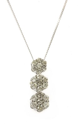 Lot 85 - A white gold diamond cluster pendant