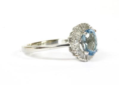 Lot 261 - A white gold aquamarine and diamond cluster ring