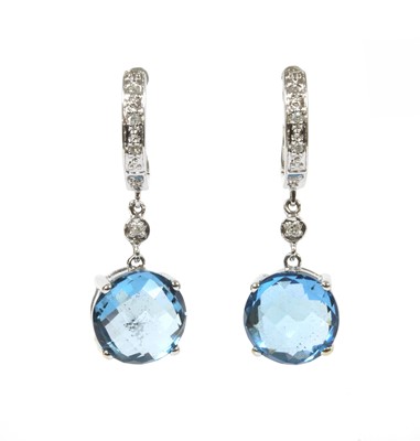 Lot 257 - A pair of white gold blue topaz and diamond drop earrings