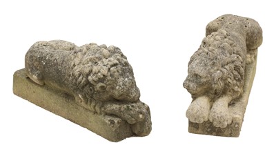 Lot 392 - A pair of composite stone lions