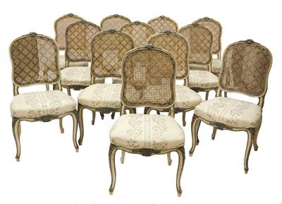 Lot 196 - A set of twelve French Louis XV-style carved and polychrome painted dining chairs