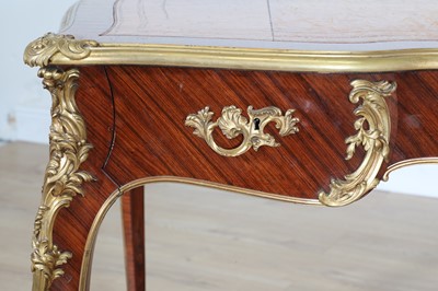 Lot 15 - A French Louis XV-style kingwood and ormolu mounted bureau plat