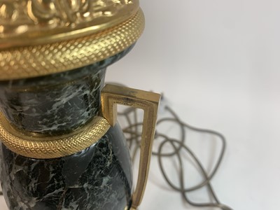 Lot 216 - A pair of French serpentine marble urn-form table lamps