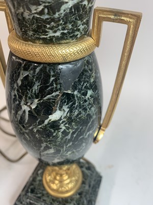 Lot 216 - A pair of French serpentine marble urn-form table lamps