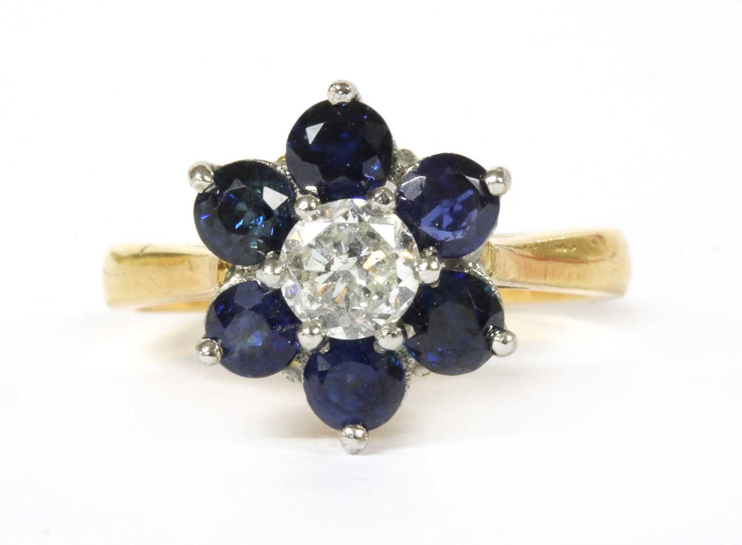 Lot 161 - An 18ct gold diamond and sapphire cluster ring