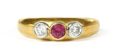 Lot 113 - An 18ct gold ruby and diamond three stone ring