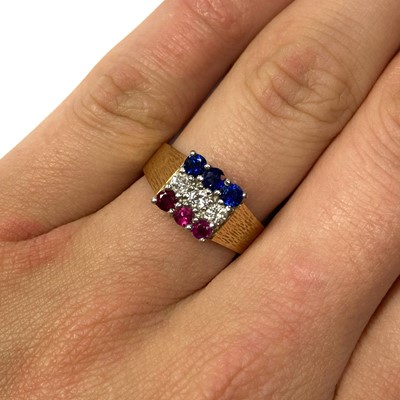 Lot 135 - An 18ct gold ruby, diamond and sapphire ring, c.1980