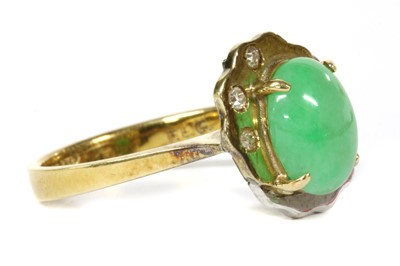 Lot 176 - A two colour gold jade and diamond ring