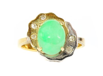 Lot 176 - A two colour gold jade and diamond ring