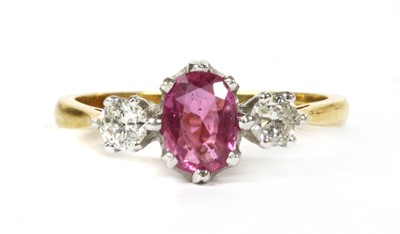 Lot 190 - An 18ct gold pink sapphire and diamond three stone ring