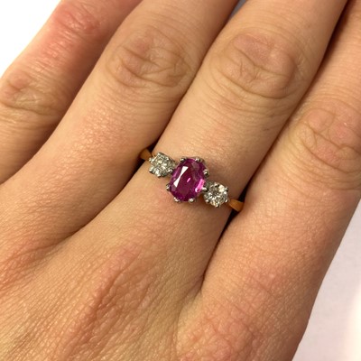 Lot 190 - An 18ct gold pink sapphire and diamond three stone ring