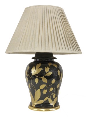 Lot 231 - A black and gilt-glazed table lamp