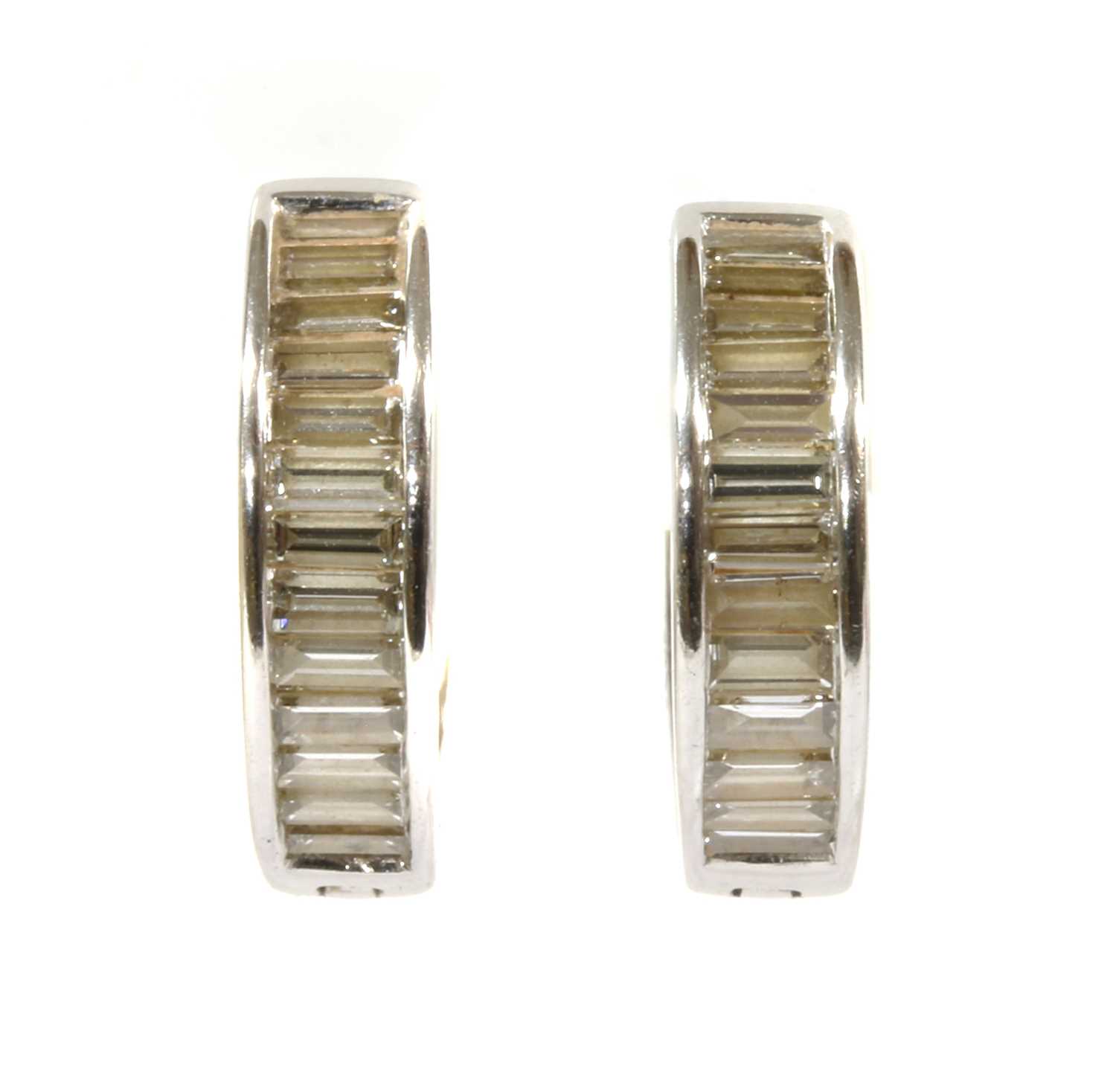 Lot 93 - A pair of white gold diamond set hoop earrings