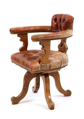 Lot 377 - A revolving desk walnut chair