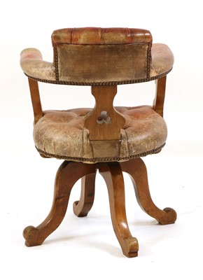 Lot 377 - A revolving desk walnut chair