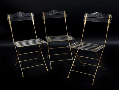 Lot 426 - A set of eighteen Lucite and gilt metal folding chairs