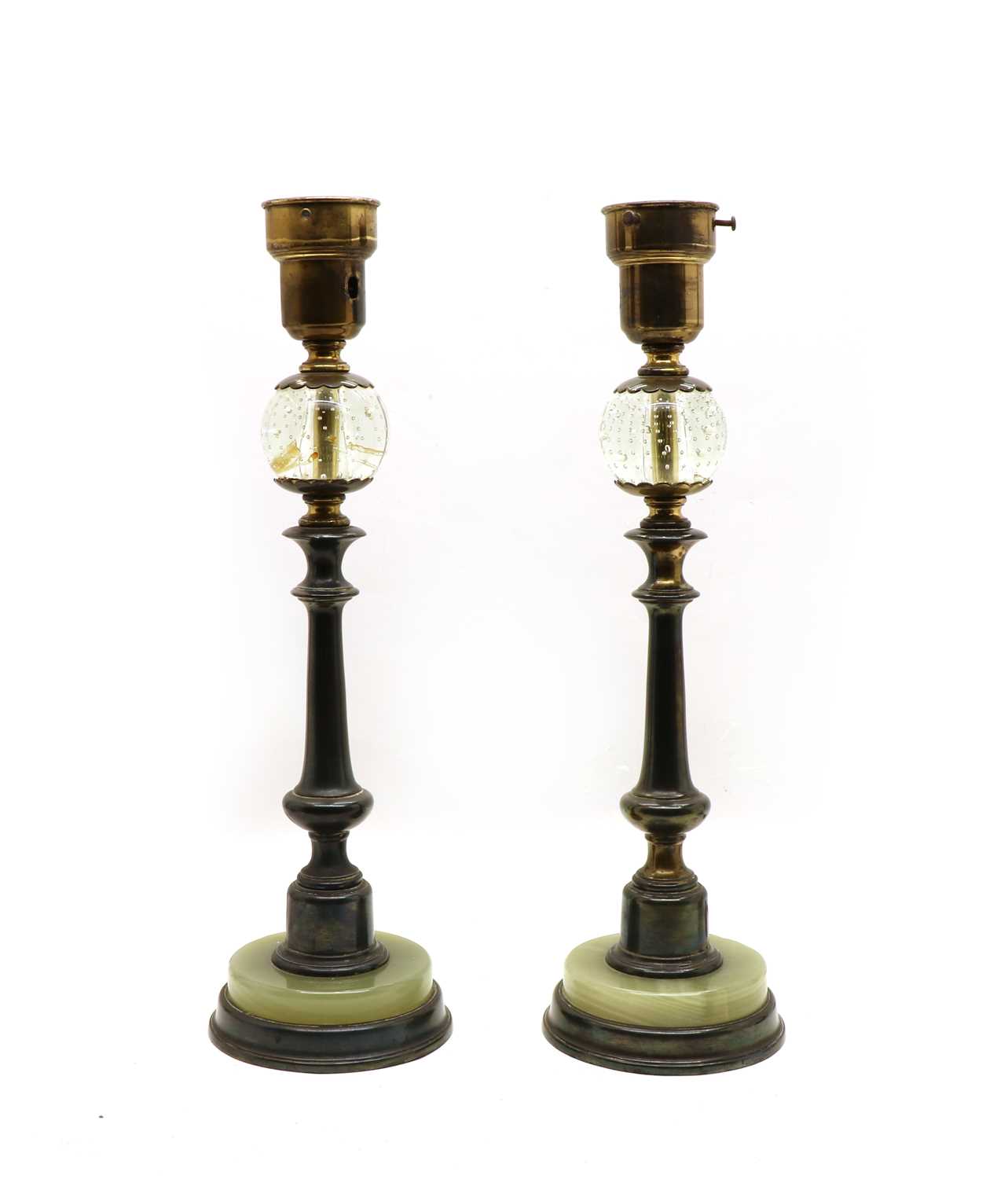 Lot 75 - An unusual pair of bronze onyx and glass table lamps