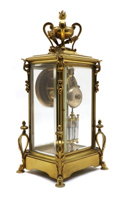 Lot 129 - A late 19th century ormolu glass mounted mantel clock