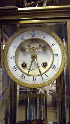 Lot 129 - A late 19th century ormolu glass mounted mantel clock