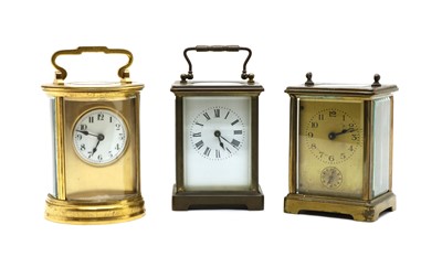 Lot 122 - A late 19th century circular shaped gilt carriage clock