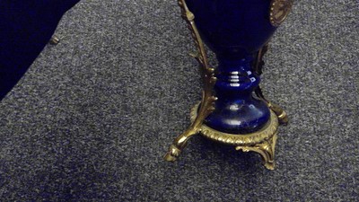 Lot 176 - A pair of ormolu mounted blue porcelain vases