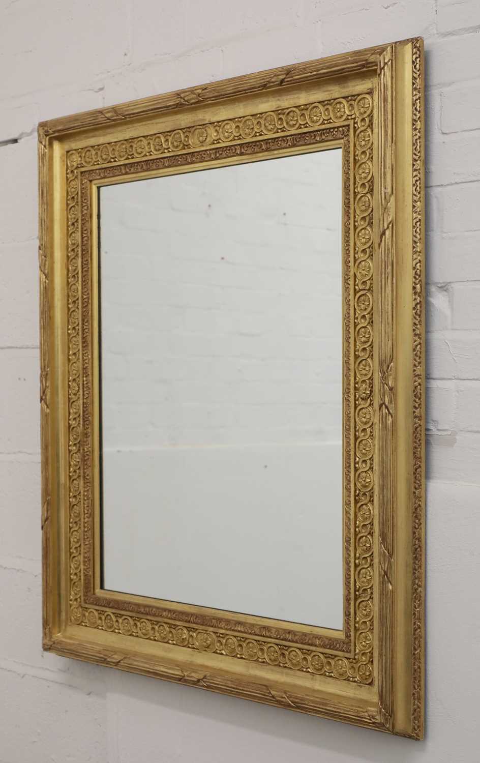 Lot 258 - A modern carved giltwood wall mirror