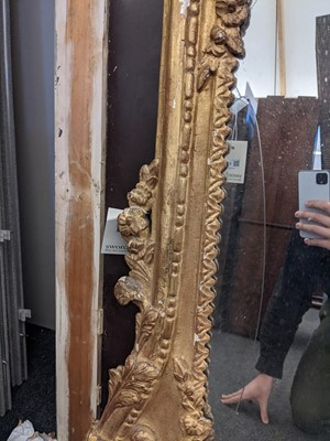 Lot 266 - A large carved giltwood wall mirror