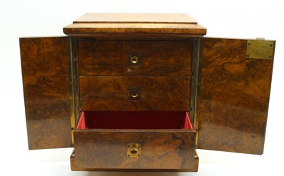 Lot 82 - A small Victorian walnut table top cabinet of drawers