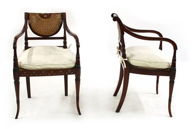 Lot 326 - A pair of reproduction painted and caned elbow chairs