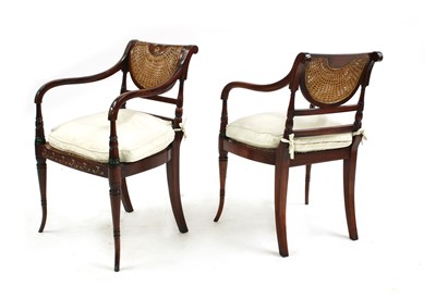 Lot 326 - A pair of reproduction painted and caned elbow chairs