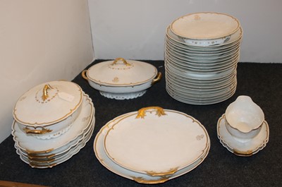Lot 150 - A Limoges porcelain dinner service, white with gold highlights