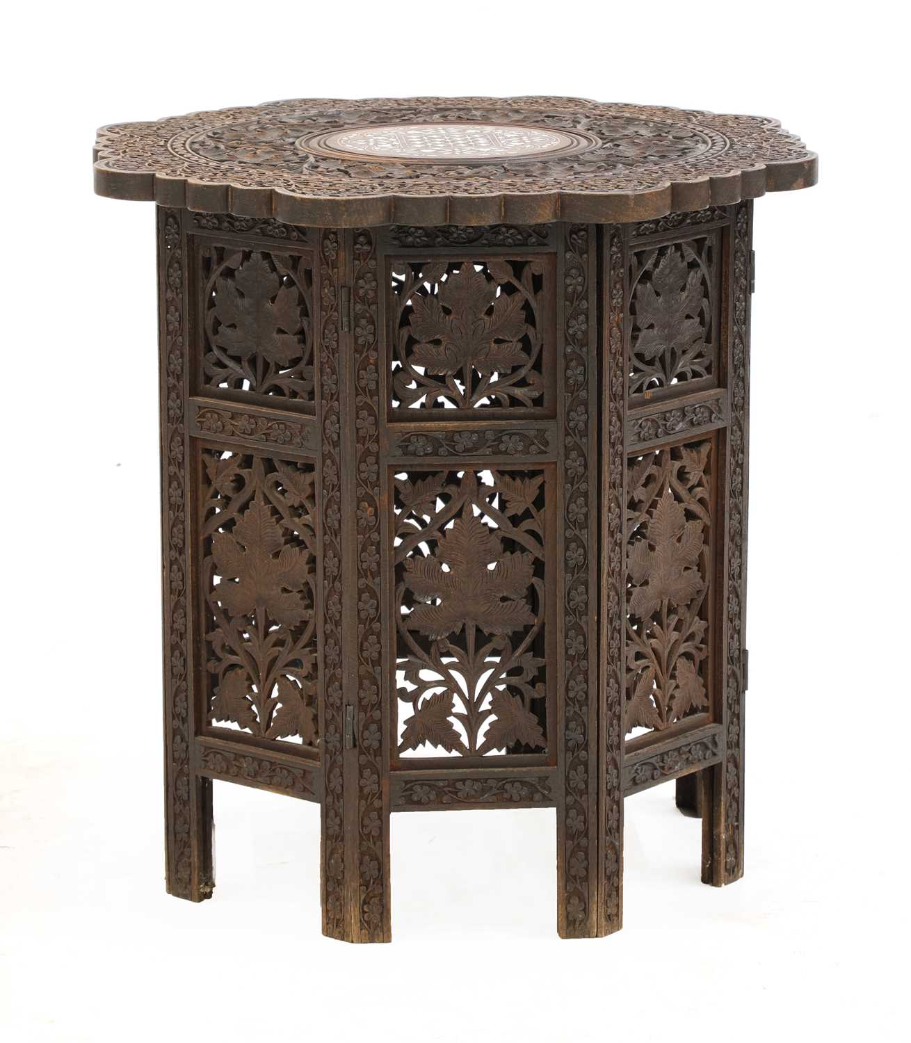 Lot 928 - A folding carved hardwood Indian table