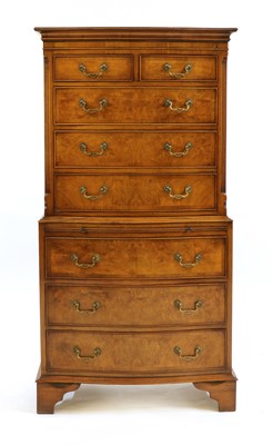 Lot 317 - A small Georgian style walnut double serpentine chest