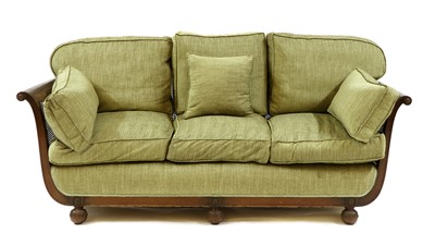 Lot 311 - A three seat mahogany bergere sofa