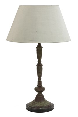 Lot 204 - A patinated metal table lamp and shade