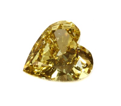 Lot 457 - An unmounted fancy yellow heart shaped brilliant cut diamond