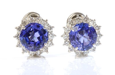 Lot 295 - A pair of 18ct white gold tanzanite and diamond cluster earrings