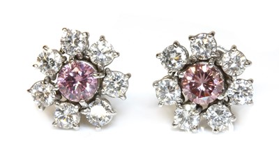 Lot 448 - A pair of fancy pink diamond and diamond cluster earrings