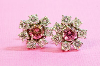 Lot 448 - A pair of fancy pink diamond and diamond cluster earrings