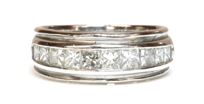 Lot 424 - An 18ct white gold diamond half eternity ring