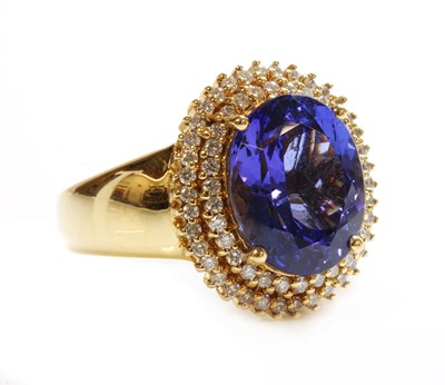 Lot 299 - An 18ct gold tanzanite and diamond cluster ring