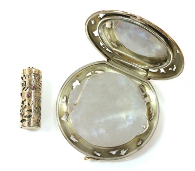 Lot 189 - A silver and gold ruby set compact and lipstick holder, by Boucheron