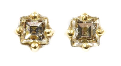 Lot 136 - A pair of single stone diamond earrings