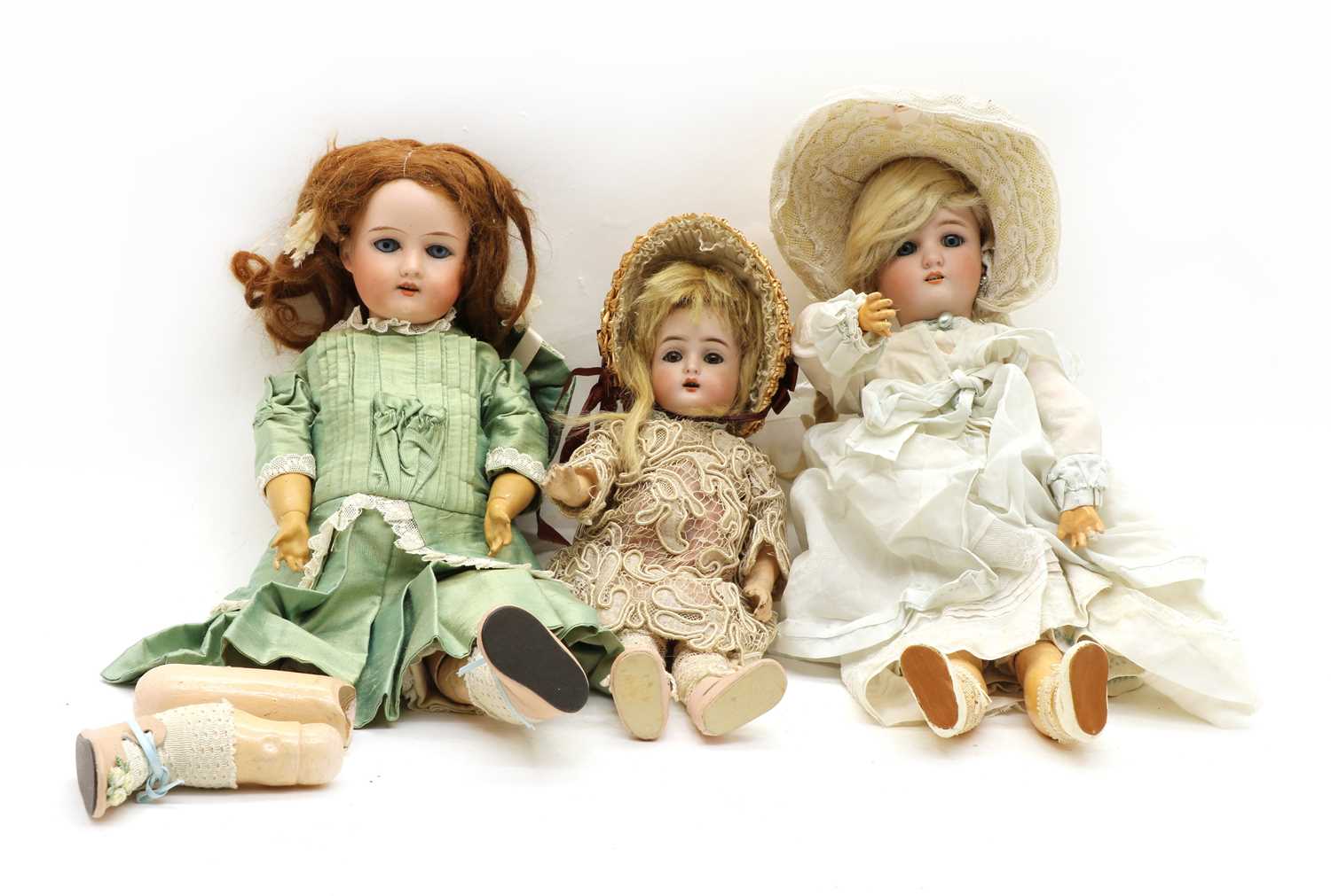 Lot 275 - Three bisque head dolls